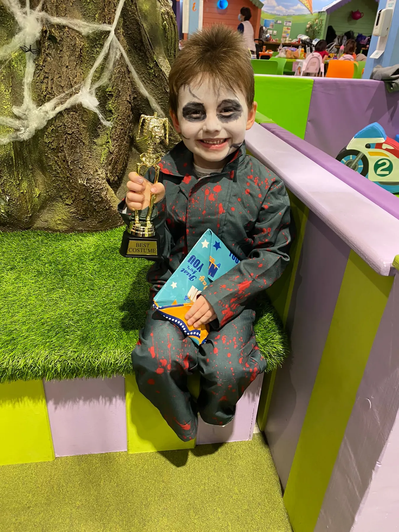 A child with face paint at a Fun Street event