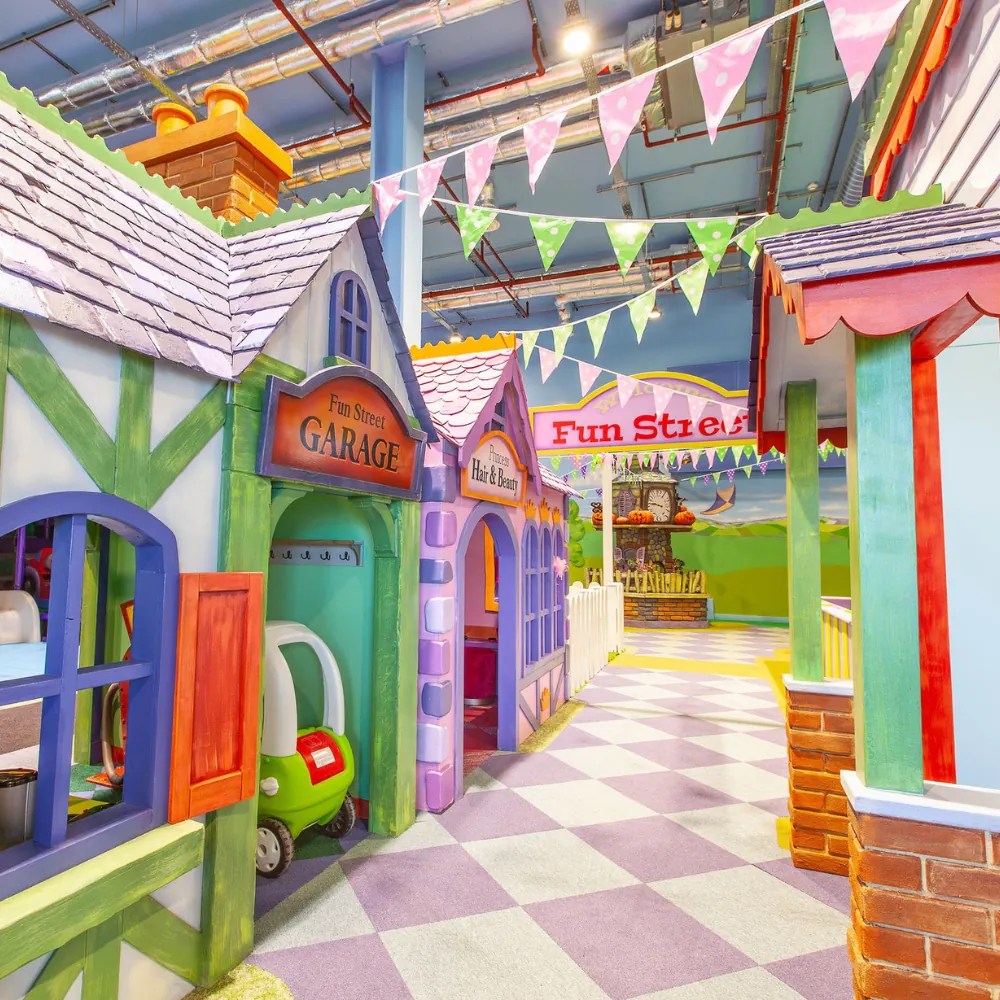The storybook street of themed playhouses at Fun Street soft play in Glasgow